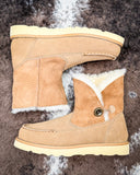 Bootie displayed on cowhide.