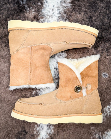 Bootie displayed on cowhide.