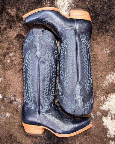  Tall Western boots on Cowhide rug with Boot stich design 