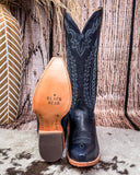  Black Star Tall Western boots on Cowhide rug with Boot stich design. Tan rubber sole bottom of the boots.