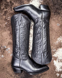 Black Leather boots on cowhide rug 