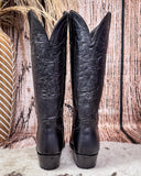 Black Leather boots on cowhide rug 