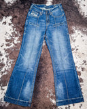 Pair of blue jeans on a textured surface