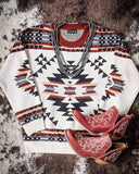 Lean On Me Knit Sweater displayed with shoes on cowhide.