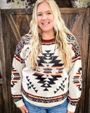 Lean On Me Knit Sweater modeled and styled on women in front of wood background.
