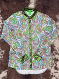 Flat lay shot of Paisley Penelope Pullover Button-Up, showing paisley print and metallic trim.