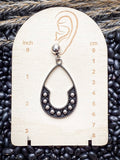 The Calico Drops teardrop earring shown on size display card.