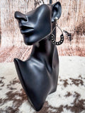 Western teardrop earring from The Calico Drops worn on mannequin.