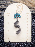 Western spiral earrings with turquoise flower on size display card.