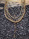 Gold toned western necklaces on beans and wheat
