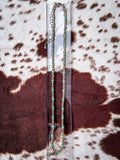 Southwestern necklace displayed on a ruler