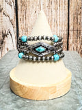 Stack of three Western beaded bracelets with turquoise and silver concho accent