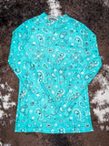 Turquoise paisley print base layer with dark wash jeans and Aztec canvas sneakers flat lay