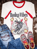 Rodeo Vibes bull rider t-shirt with jeans and Twisted X Aztec print sneakers