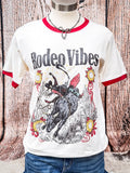 Western Rodeo Vibes ringer tee with red trim and bull rider graphic on mannequin