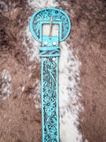 Turquoise tooled leather belt buckle with western floral engraving and silver prong.