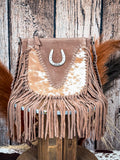 Western-style fringe cowhide bag with suede body and decorative horseshoe accent