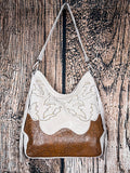Back of ivory western fringe handbag with embroidered suede and tooled leather base