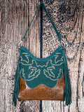 Front of green suede fringe purse with embroidered western design and tooled leather base