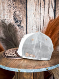 Side view of western mesh trucker hat with Myra logo and tooled leather brim
