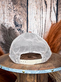 Back of adjustable mesh trucker hat in brown and tan with snapback closure