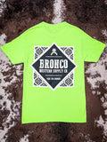 Full rear view of neon green western tee featuring Bronco Western Supply Co. graphic.