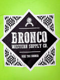 Close-up of Bronco Western Supply Co. back print in white and black on neon green t-shirt.