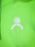 Zoomed detail of white spur and horseshoe logo on neon green hoodie chest