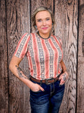 Side angle of western puff sleeve shirt with vertical peach and navy patterns.