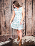 Model twirling in Lucky & Blessed Desert Skies Aztec Print Sleeveless Dress, showcasing flowy fit.