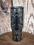 Tumbler with rear handle and western print.

