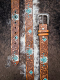 Hooey aztec belt on cowhide background