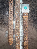 Hooey Rogue belt on a cowhide background