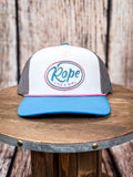 Front view of Rope Like a Girl Hooey hat on a wood background