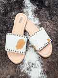 Sandals posed to show off cow hide