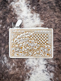 Card older laying on cowhide