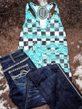 Flat lay of tank top with Cowgirl Tuff Jeans