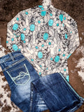 Flat lay of mesh top and cowgirl tuff jeans