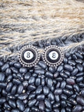 Earrings shown on beans and wheat