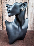 Mannequin wearing an earring