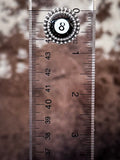 Earring on ruler for size