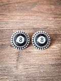 Earrings shown on wood