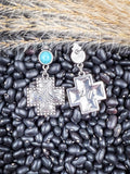 Front and back of dangle earrings shown on beans and wheat