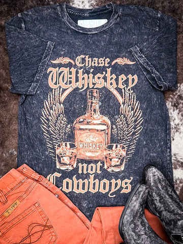 Styled flat lay of the Chase Whiskey Graphic Tee with Cowgirl Tuff Jeans and Myra Boots.