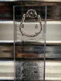 stirrup earring on ruler