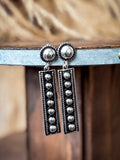 earrings on table