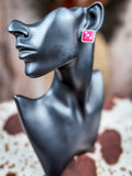 pink dice earring on mannequin 