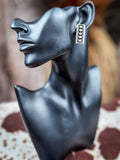stud earring on mannequin