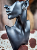 stud earring on mannequin
