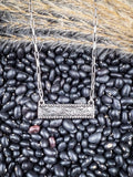bar necklace on beans and wheat